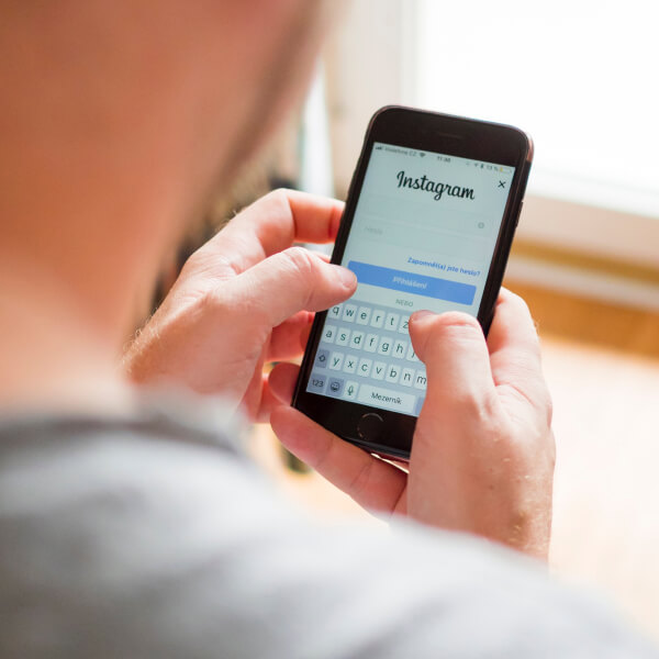 A person typing on mobile device representing digital marketing benefits- webtecherp